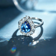 Deep Blue Teardrop Sunburst Zircon Ring